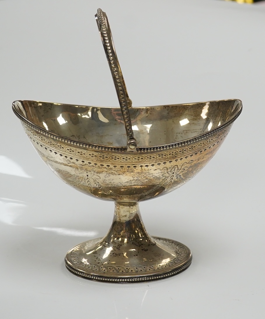 A Victorian engraved silver oval pedestal sugar basket, Henry Holland, London, 1869, width 15.5cm, 7.3oz. Condition - poor